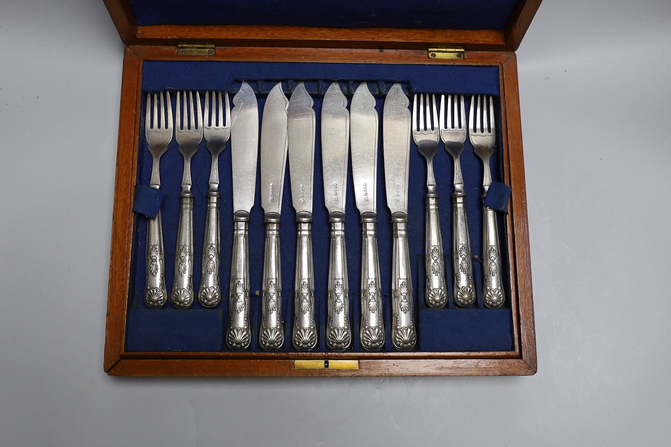 A 19th century rosewood tea caddy and a cased set of 12 plated fish servers, caddy 18cms wide x 14cms high